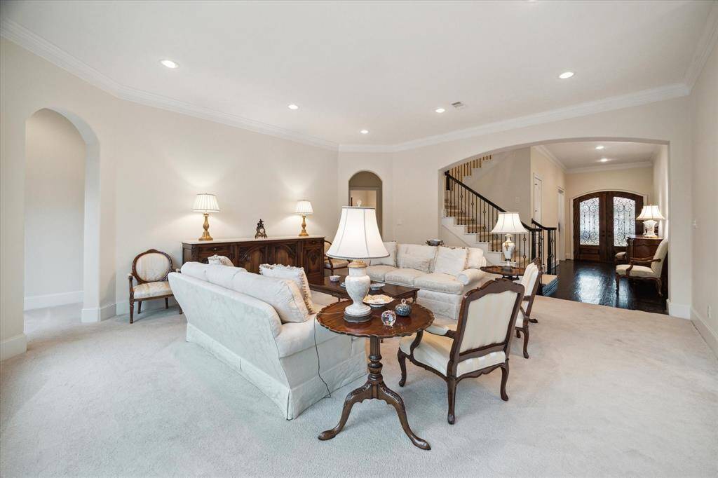 View from the Living Room to the Front Hallway - allowing  easy flow for guest entry and entertaining small to large groups of family and friends!