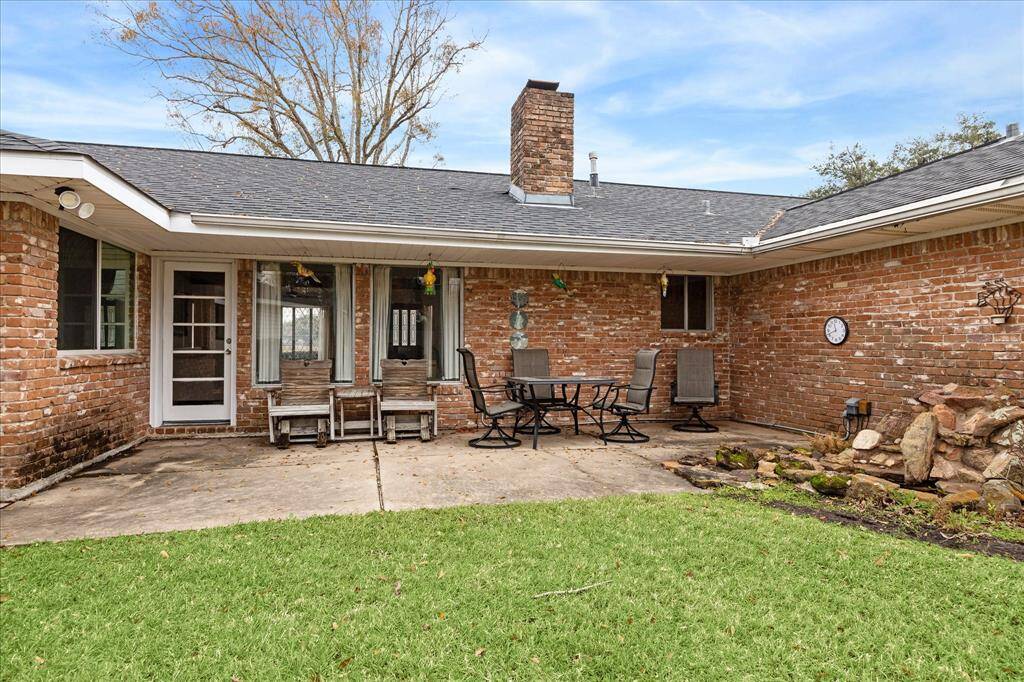 Covered Patio overlooks spectacular lot.