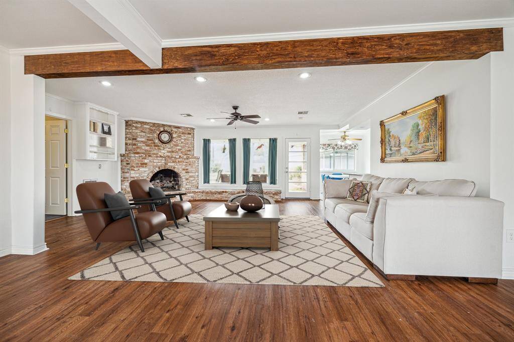 Virtually staged living and family room space was combined to one large open space.