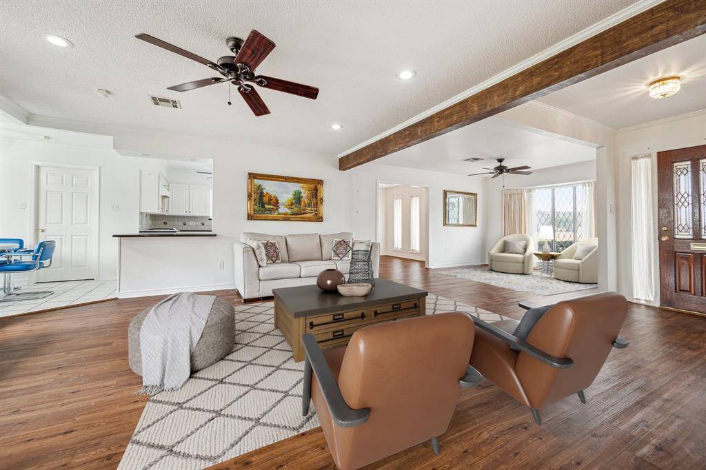 Virtually staged view looking into kitchen