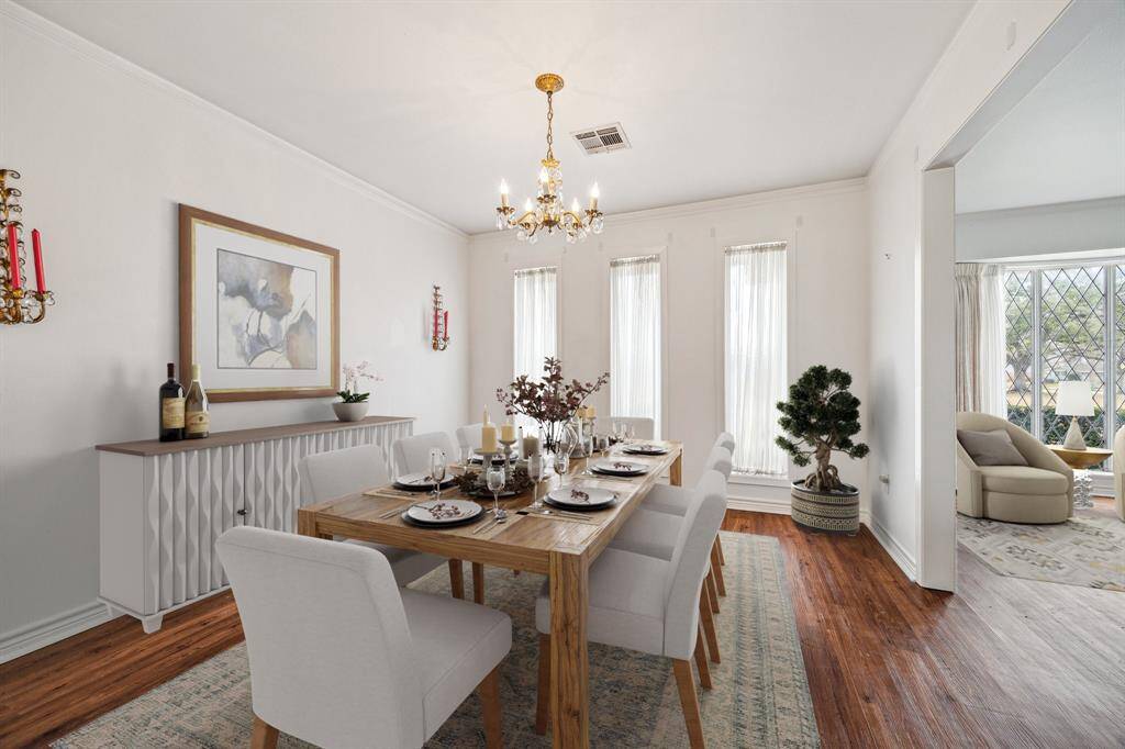 Virtually staged. Lovely dining room space.