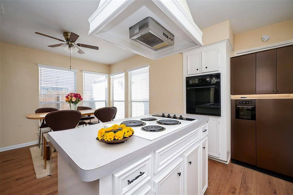 Cooking on your electric cooktop lets you stay engaged in conversations in the adjacent break area!
