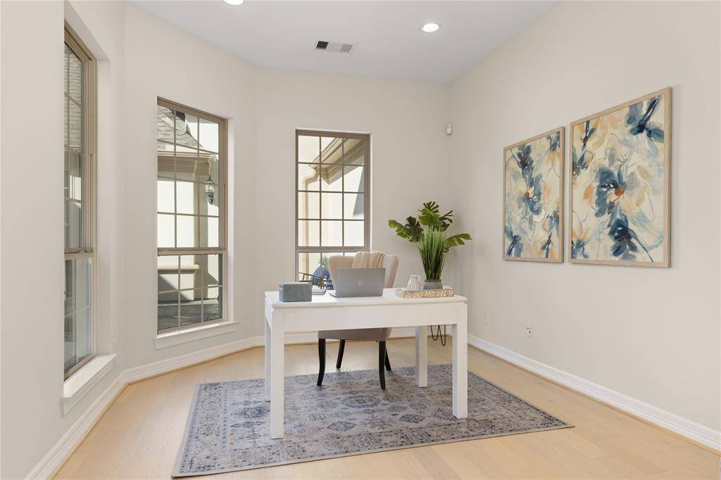 Tranquil private study with serene courtyard views.
