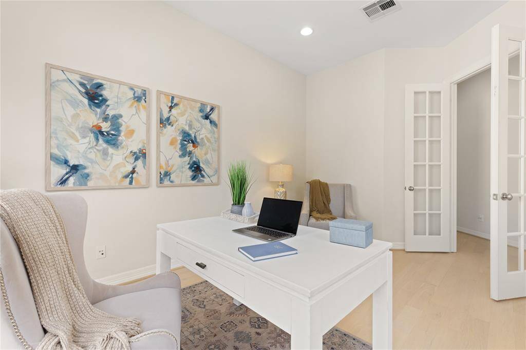 Cozy study with elegant French doors for privacy.
