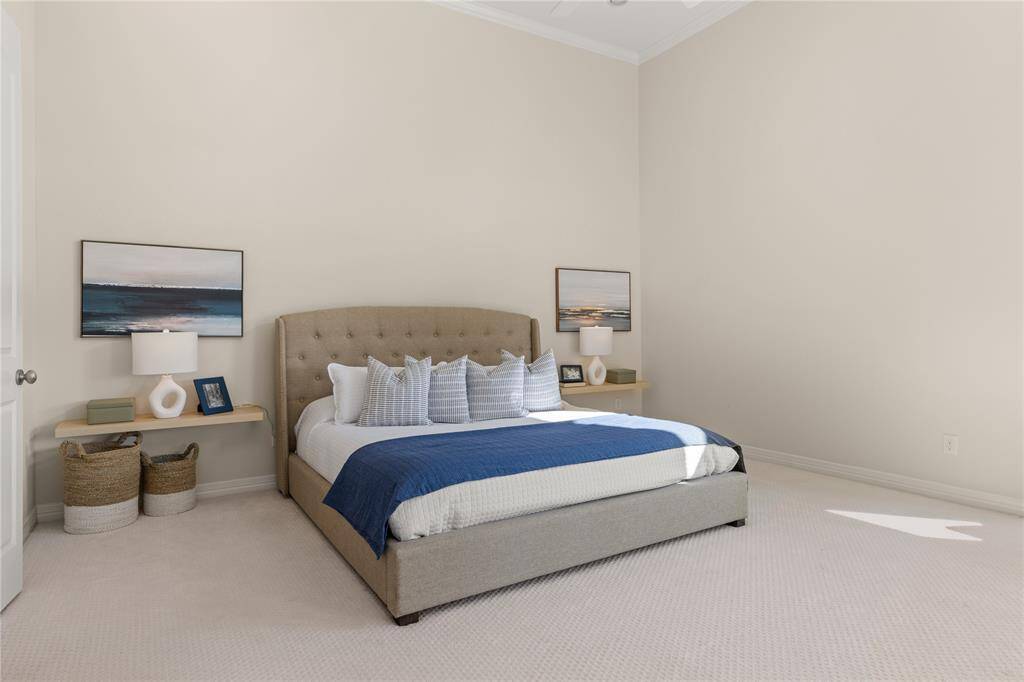 Expansive primary bedroom with abundant natural light.