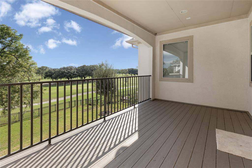 Enjoy serene views from this spacious balcony featuring cool-tech decking.