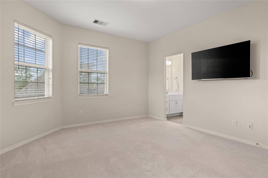 Spacious bedroom with convenient access to the shared Hollywood bath.