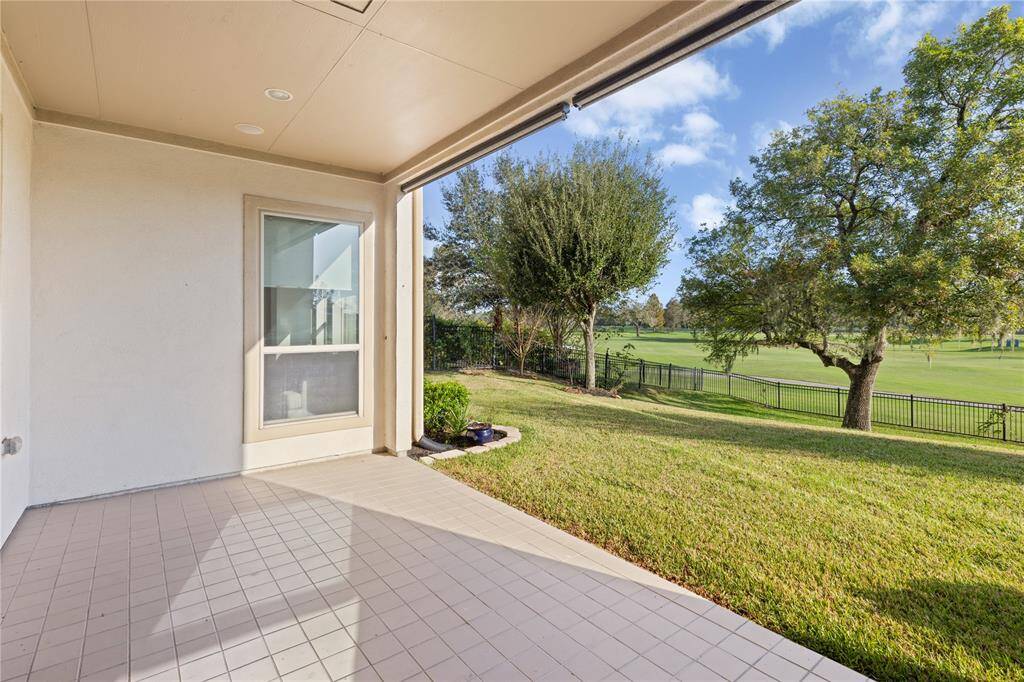 Serene back patio with lush views—perfect for relaxation and gatherings.