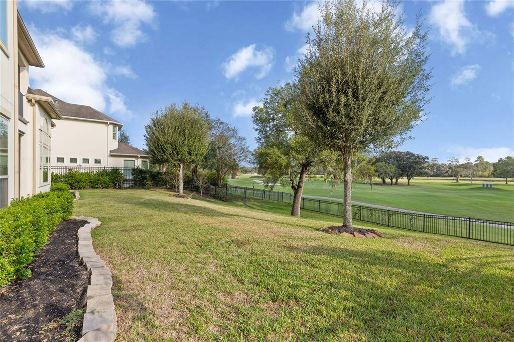 Expansive yard perfect for a custom pool oasis.