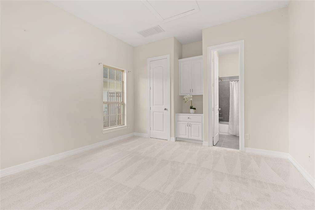 This versatile space features a full bathroom, walk-in closet, and a convenient nook for a mini-fridge and microwave—perfect for transforming into a cozy studio apartment.