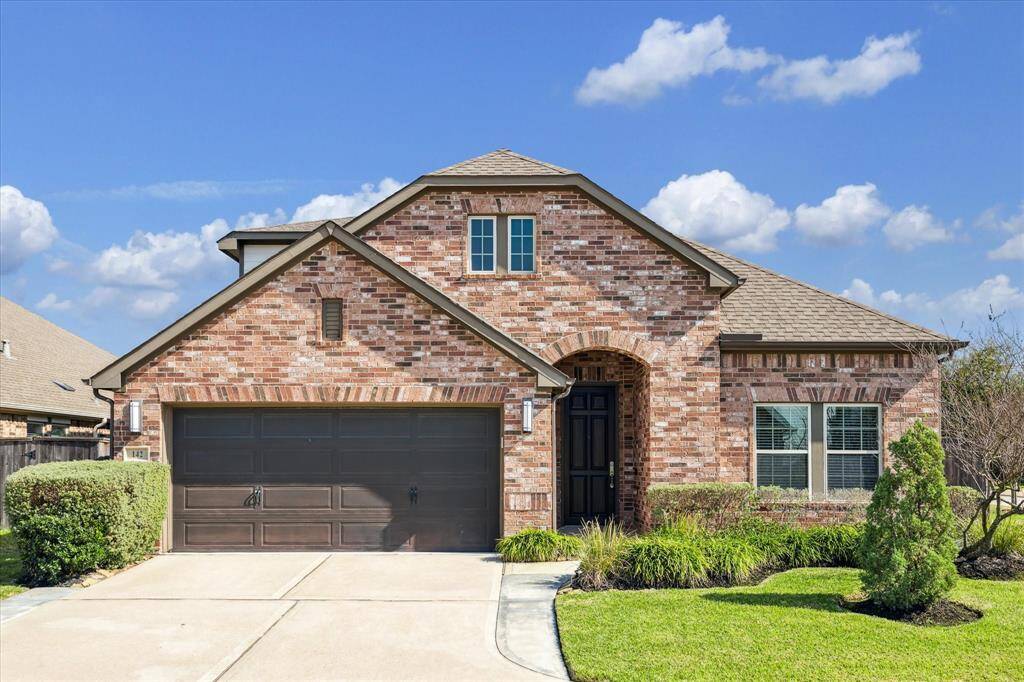 Beautiful and well-maintained home situated on a corner lot.