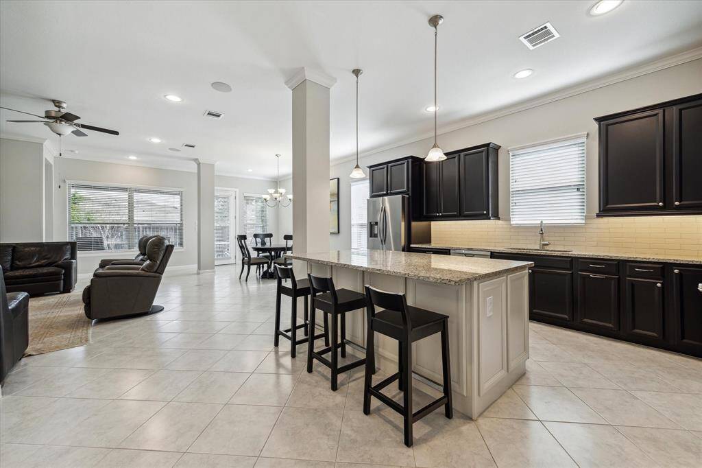 Open-concept kitchen, living and dining area.
