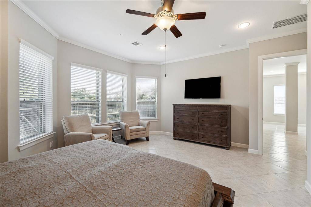 Large primary suite with tons of natural lighting.