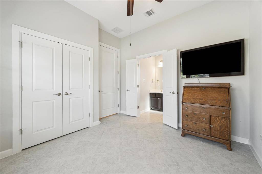 First-floor bedroom with attached full bathroom, including a walk-in-shower.