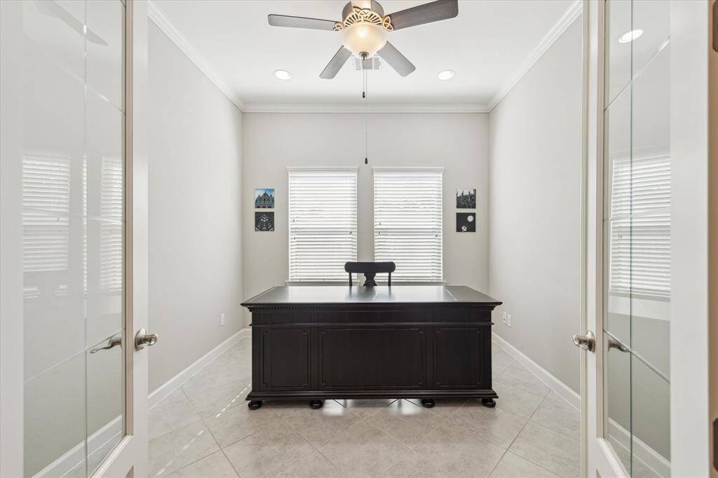 Dedicated office space offers beautiful french doors and sizeable windows.