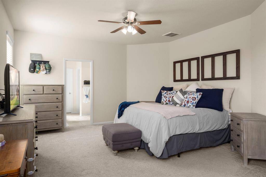 Welcome to this oversized primary bedroom!.  This room is spacious and provides plenty of privacy and relaxation.