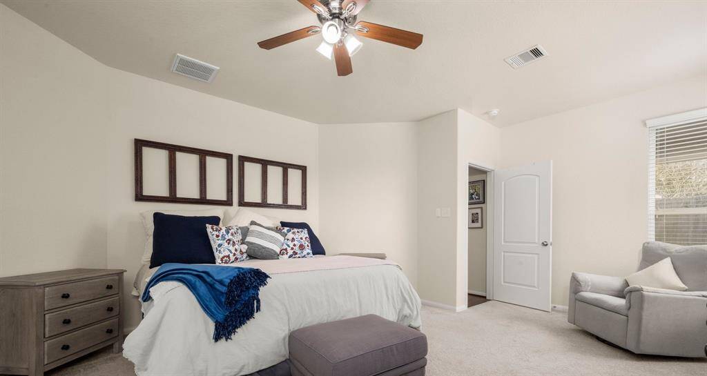 There is additional space for an additional seating area or desk.