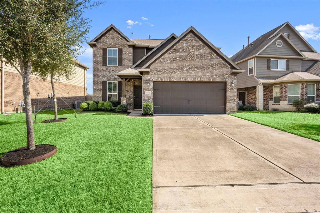 This home has a large 2 car garage with extra storage.