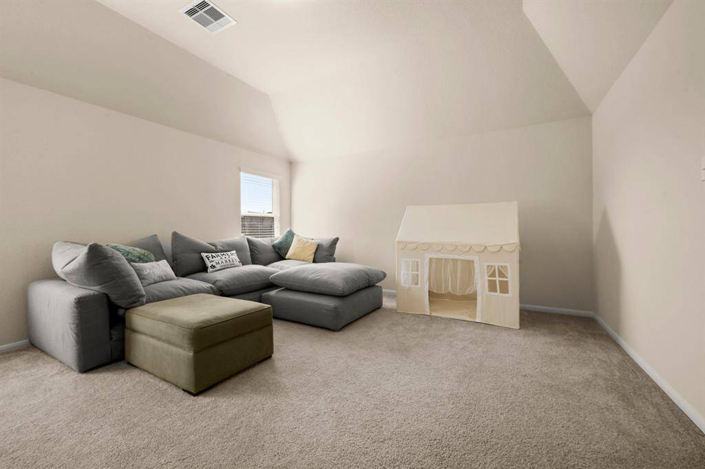 This game room has so much space and great natural light!