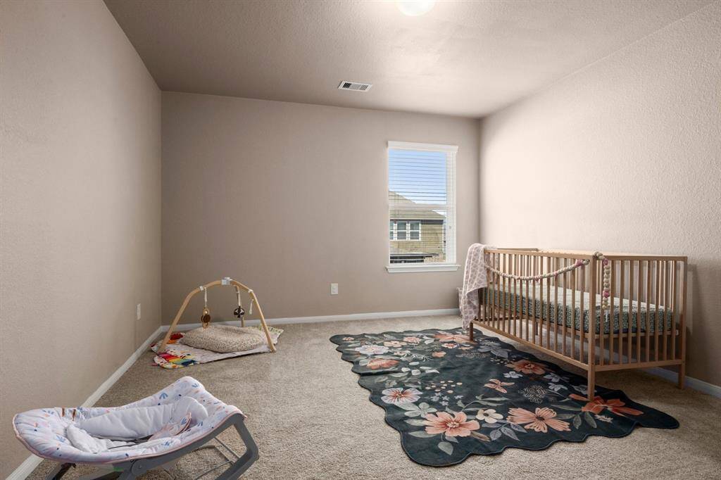 The third bedroom is a large space with a walk-in closet.