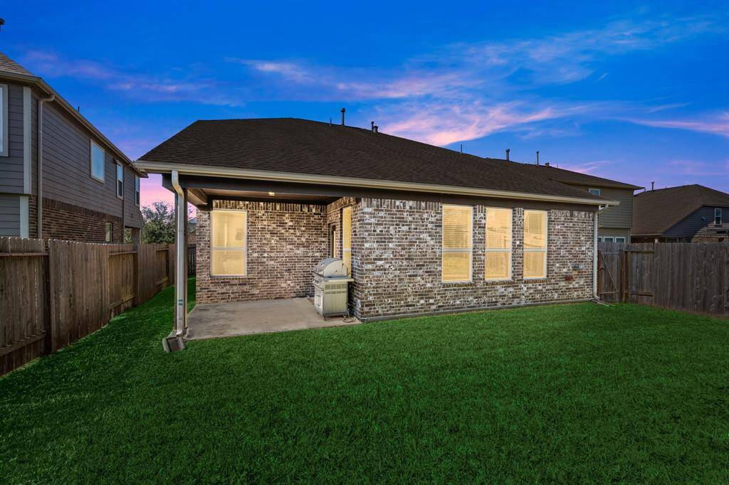 The covered patio has a gas connection just waiting for your new grill!