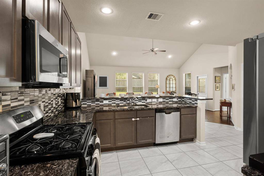 This kitchen has it all!  The gas stove will be loved by any cook for any occasion. The granite counter tops are an added touch!