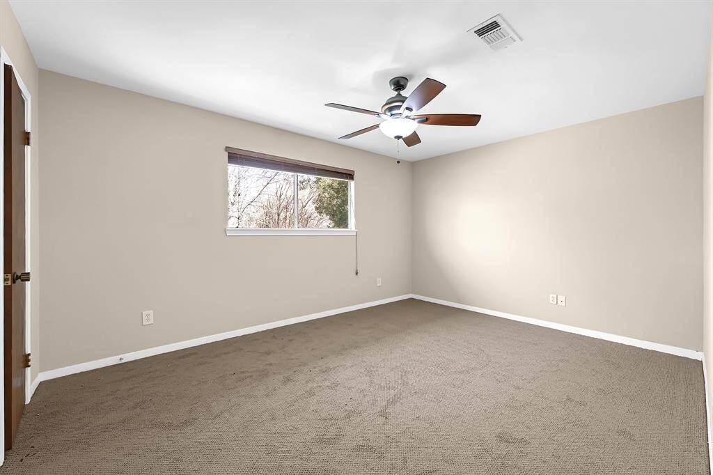 Another view of the primary bedroom virtually staged