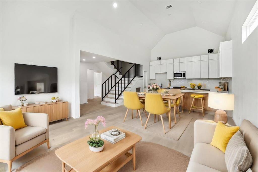 Spacious living area with soaring ceilings (virtually staged)