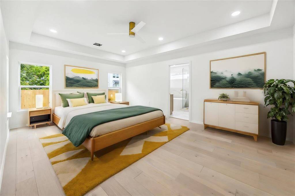 Oversized primary suite with vaulted ceiling (virtually staged)