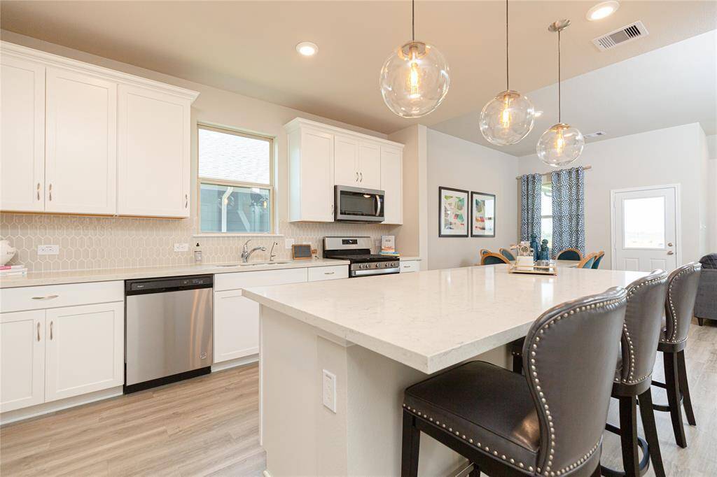 Sample photo of completed home with similar plan. As-built color and selections may vary.