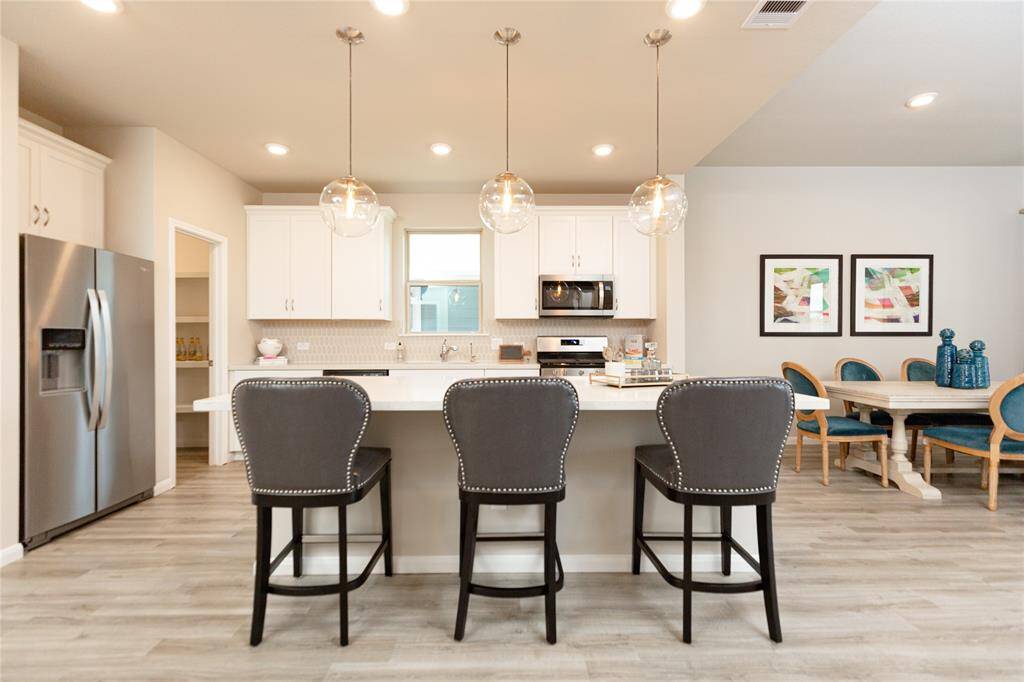 Sample photo of completed home with similar plan. As-built color and selections may vary.