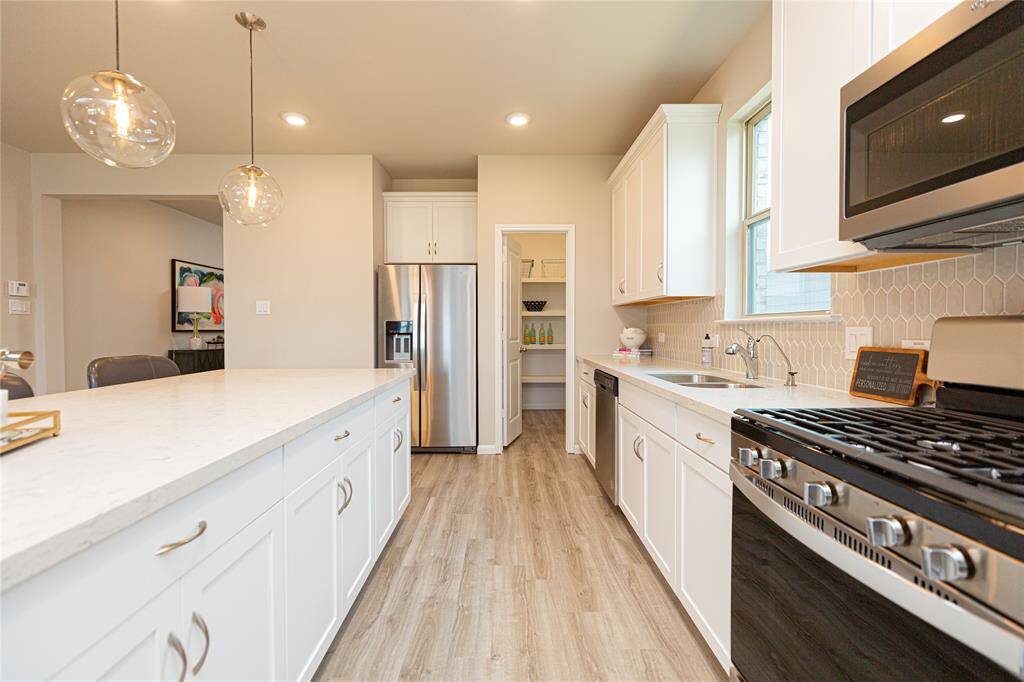 Sample photo of completed home with similar plan. As-built color and selections may vary.