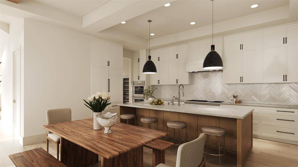 Island Kitchen with Brekafast Bar Seating, Inset Cabinets/Drawers, Slab Quartz Counters, 3 x 12 Tile Back-Splash in a Herringbone Pattern, Under-Cabinet Lighting. All Thermador Appliances, Including: 48 Inch Wide 6 Burner Gas Range-Top with Griddle, 48 Inch Range Hood, 30 Inch Double Ovens, Panel Ready Dishwasher, Drawer Microwave, 48" Panel Ready French Door Refrigerator/Freezer.