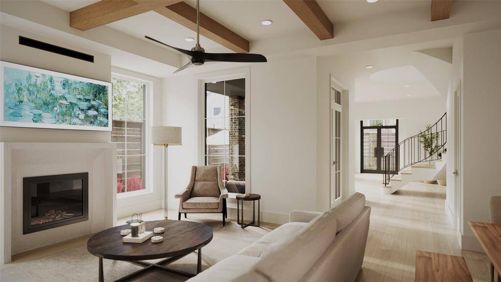 Family Room with a 42" Direct Vent Fireplace with a Cast Stone Surround, Boxed Beam Ceiling, MinkaAire 3 Blade 60" Ceiling Fan Finished in Brushed Nickel with Coal Blades.  There is also a covered patio just off the Family Room