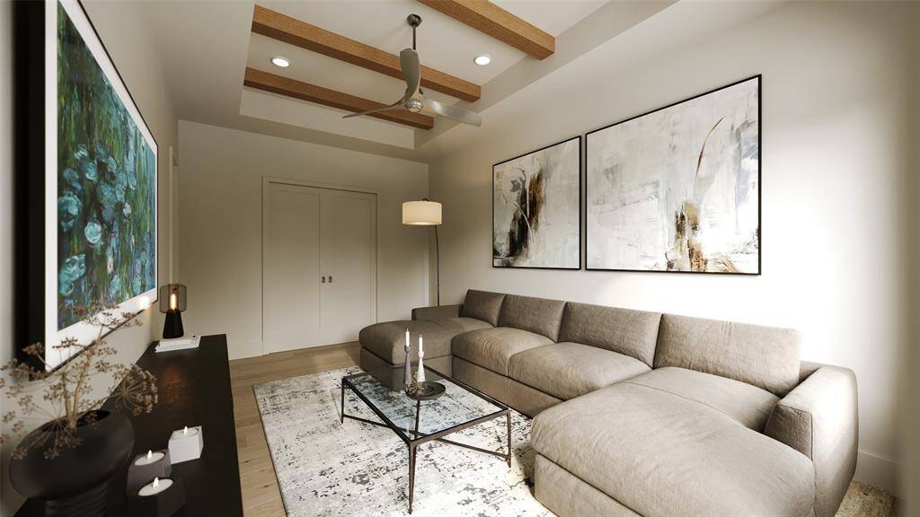 Second Floor Media Room with a Coffered Ceiling, Boxed Beams and a MinkaAire 3 Blade 60" Ceiling Fan Finished in Brushed Nickel with Silver Blades.