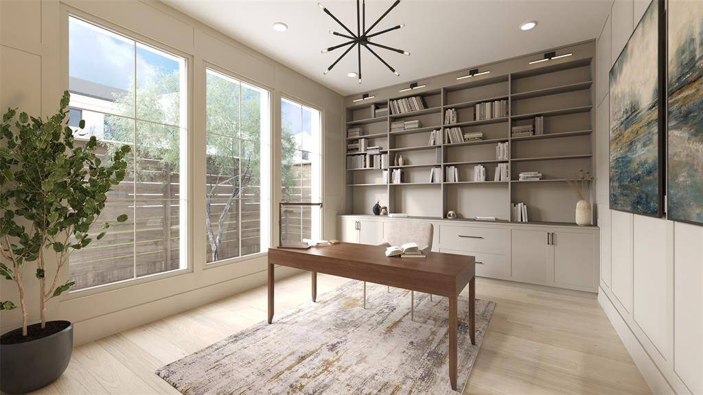 Study off the entrance of the home with beautiful paneled walls.  There are also built-in bookshelves, cabinet doors and drawers.  There are bookcase lights mounted to the top of the cabinet.  There is also a coordinating 12 Light 30" Wide Sputnik Chandelier from Visual Comfort.