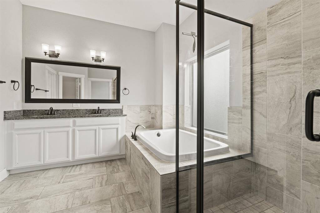 Ensuite bath with double sinks.
