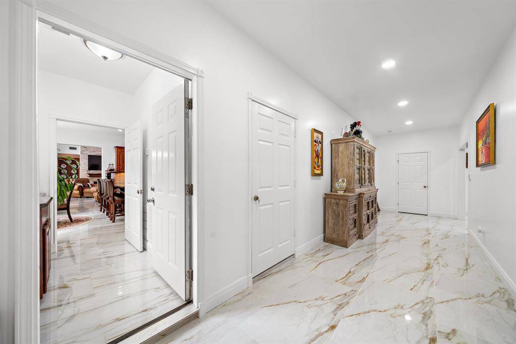 Wide hallway with polished floors and bright lighting
