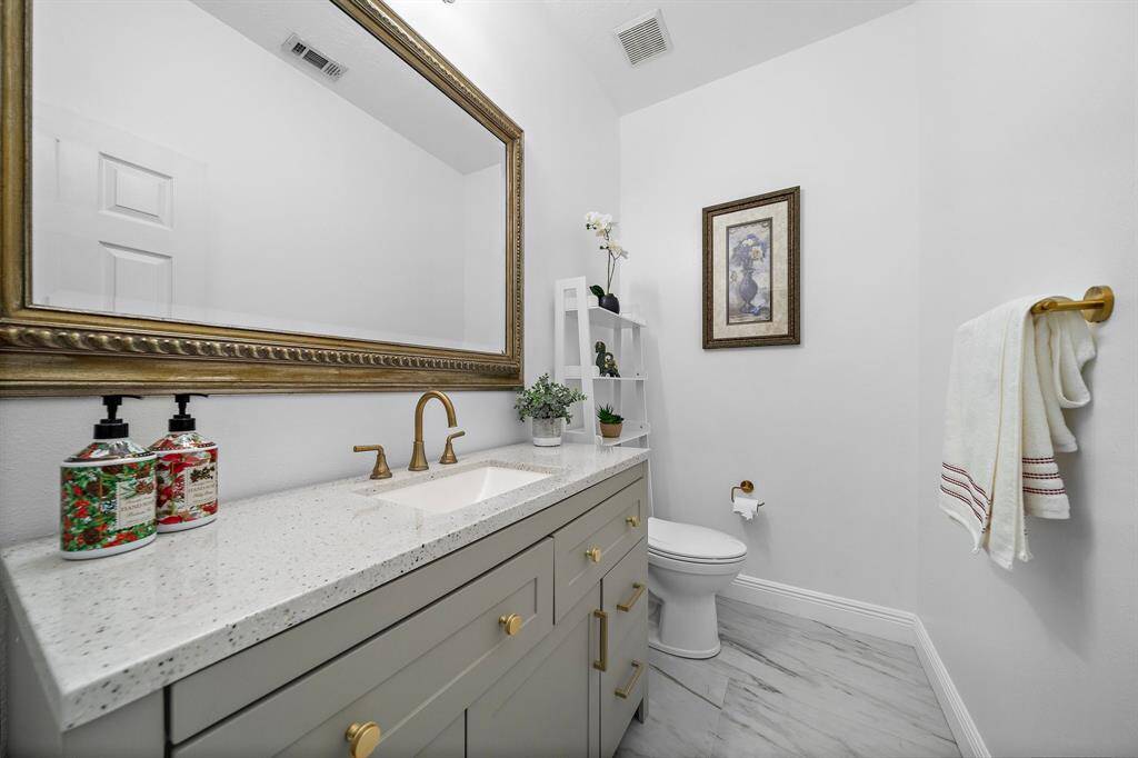 Bright powder room with neutral tones and clean design