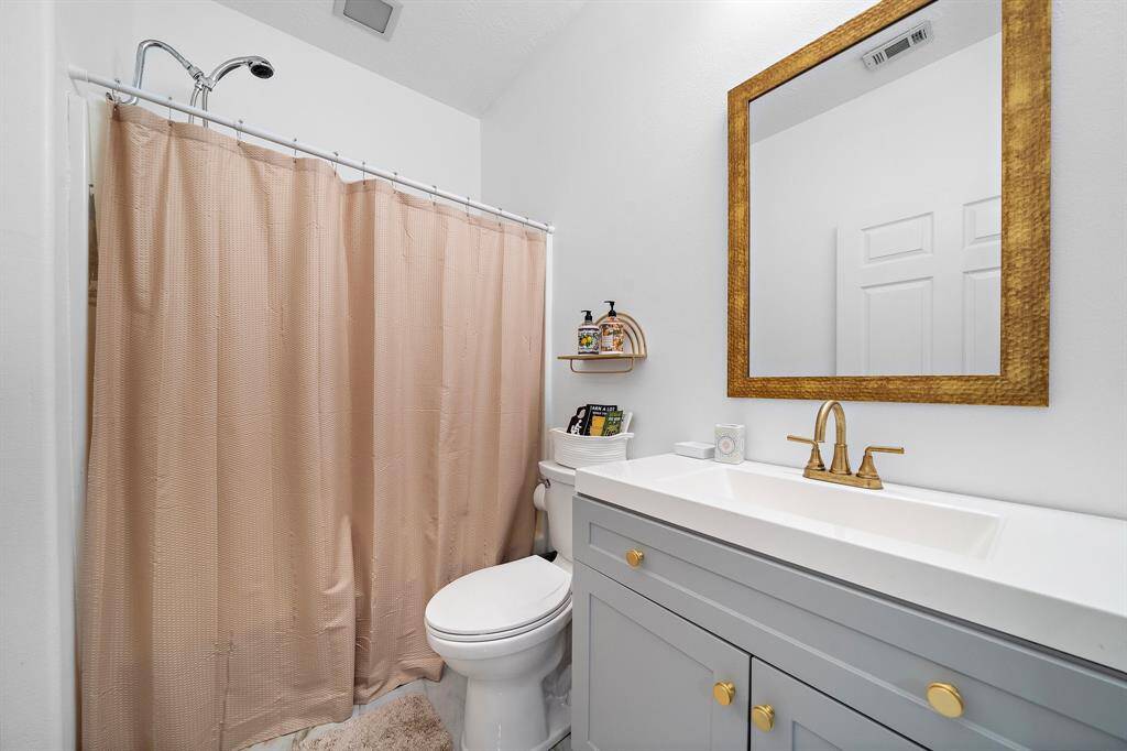 Bathroom with a shower and simple, clean design