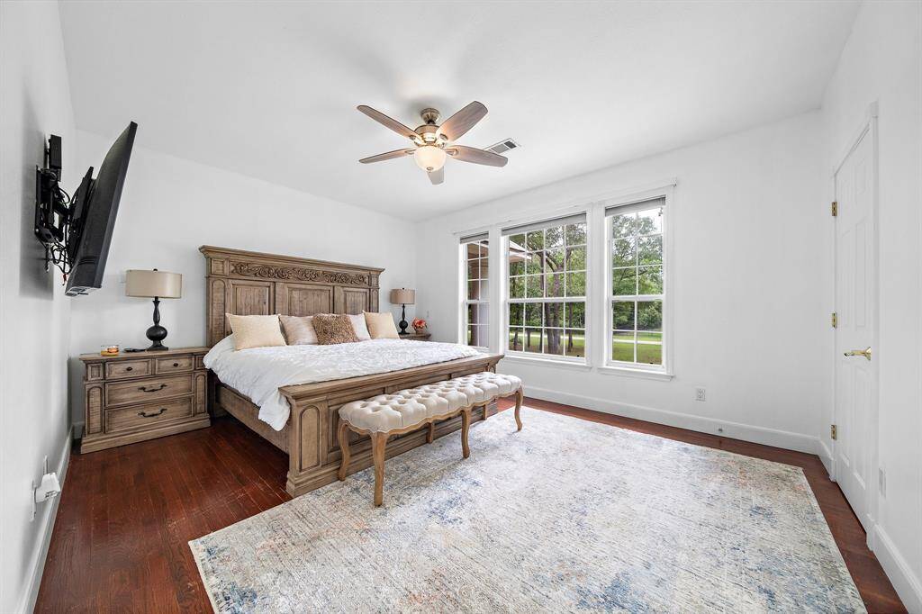 Bright bedroom with large windows and a serene view