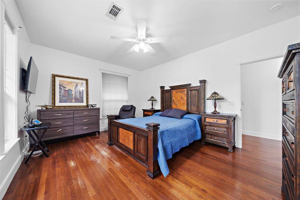 Inviting bedroom with large windows and neutral walls