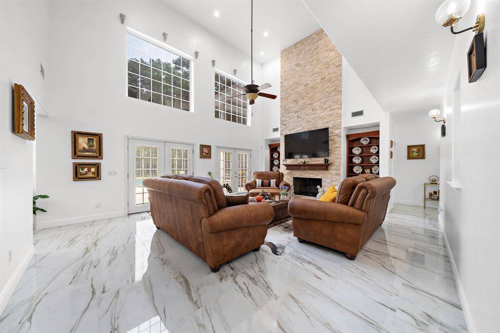 Spacious living area with large windows and natural light