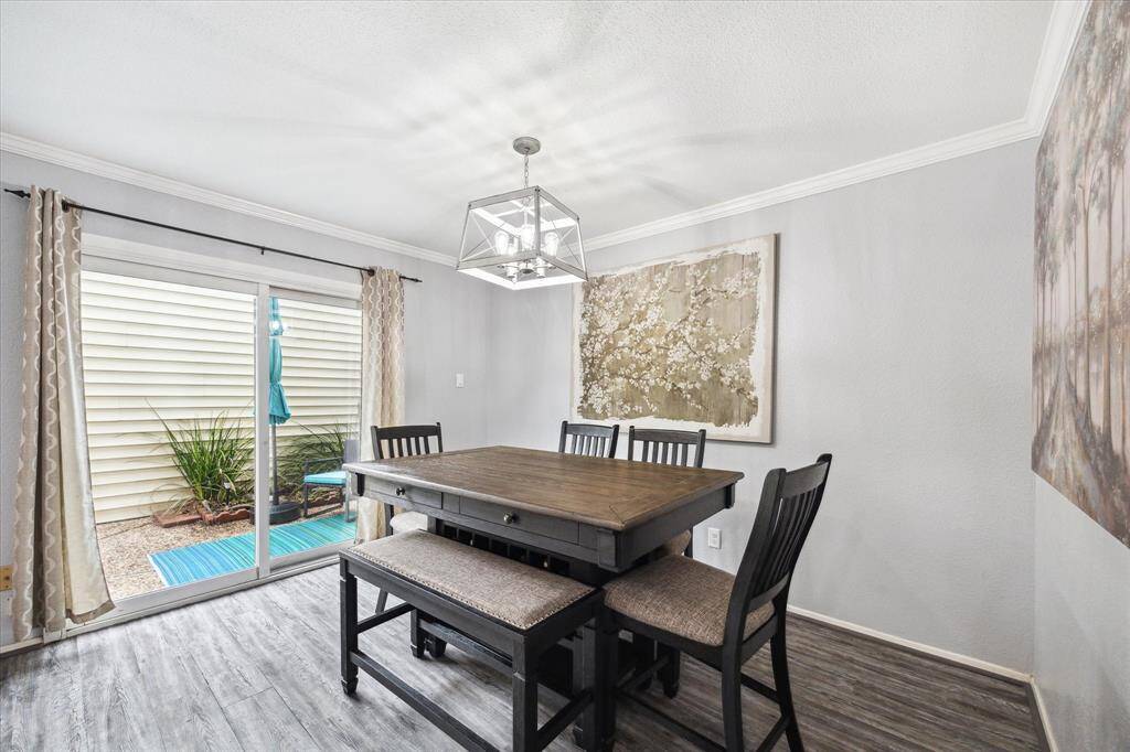The dining room opens to the patio, which allows for ease of use and entertaining. Could also be used as a sitting area!
