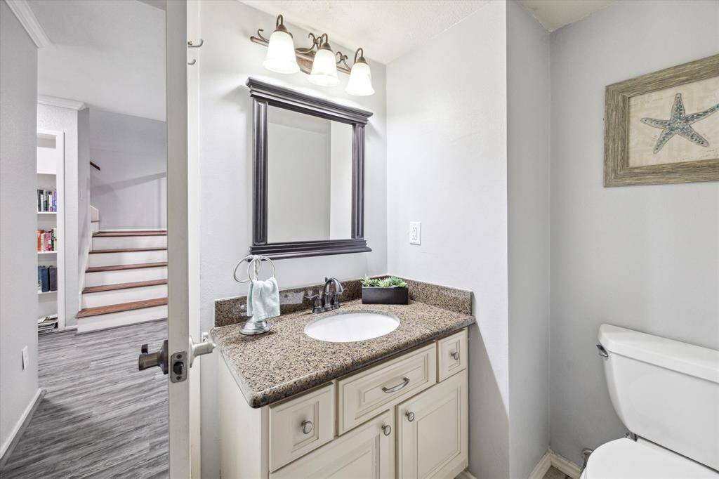 Conveniently located in between the kitchen and the living room is the half bath.