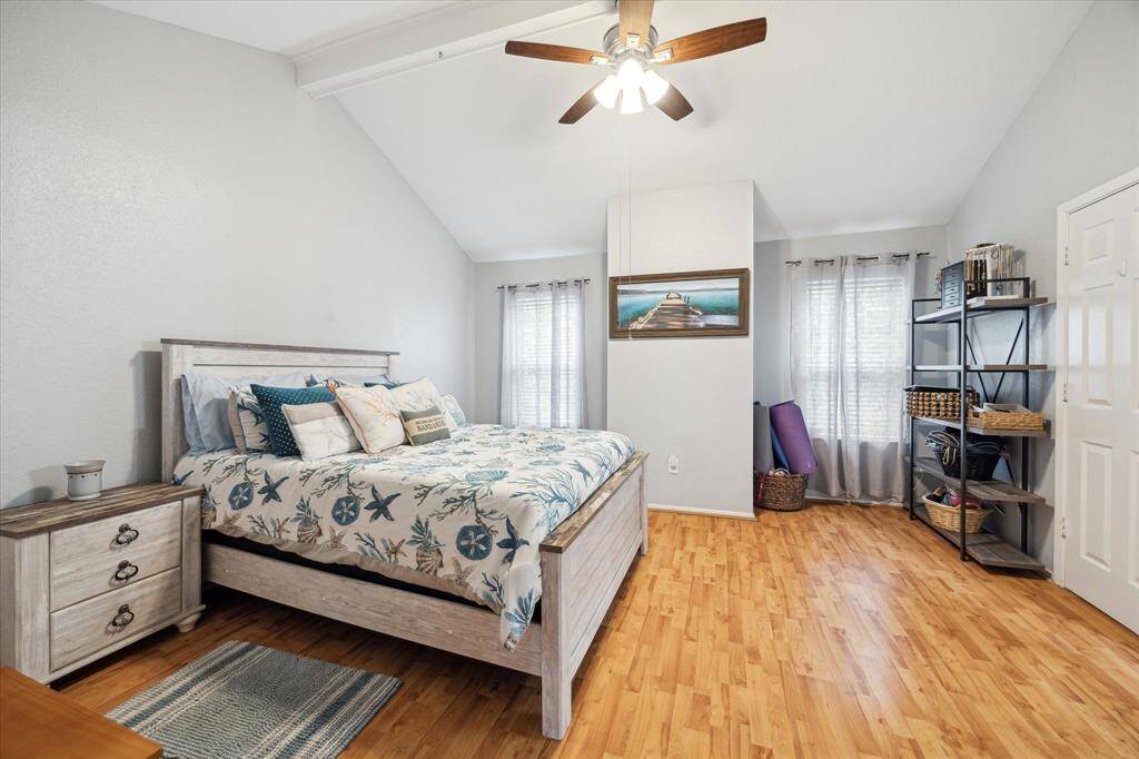 The primary bedroom features a ceiling fan, hardwood flooring, crown molding, and a vaulted ceiling. Hardwoods and crown molding throughout the second floor.