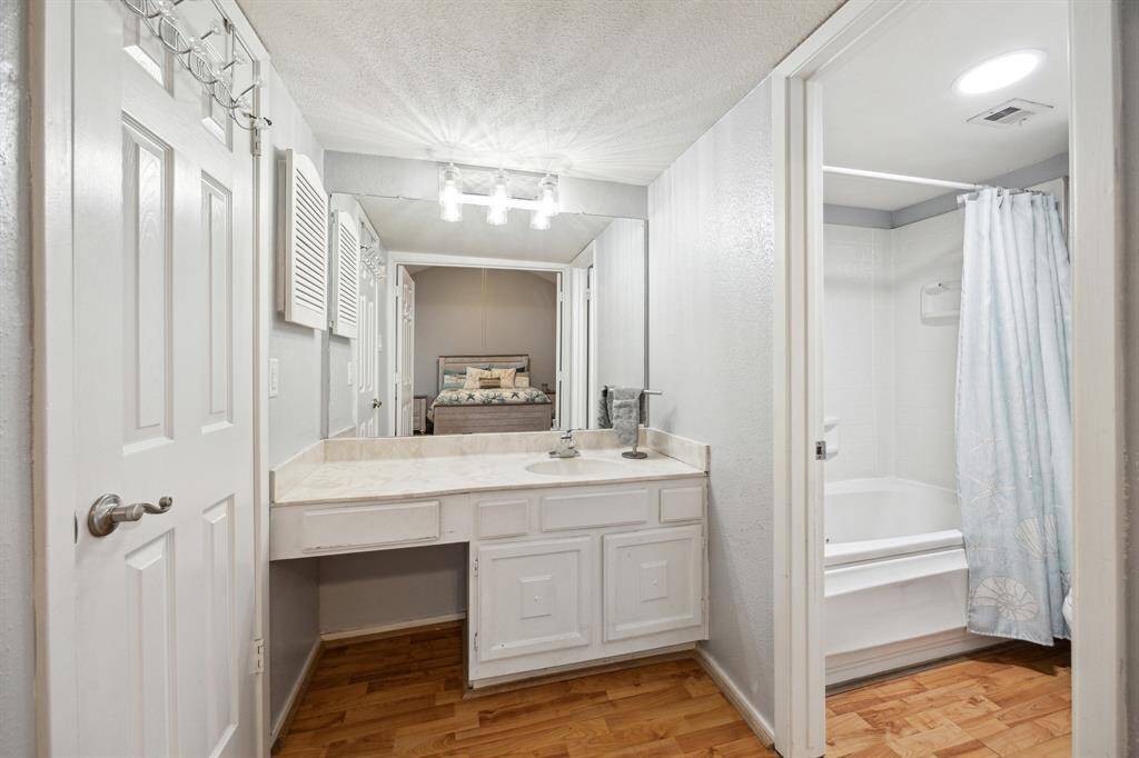 In the primary bathroom, find a spacious counter with a vanity area, a shower/tub combo, and plenty of storage.