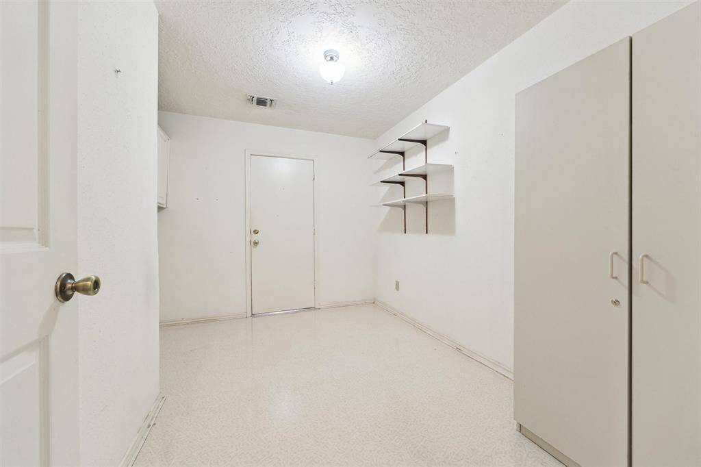 Larger than normal utility room which leads to the garage that has extra storage room.