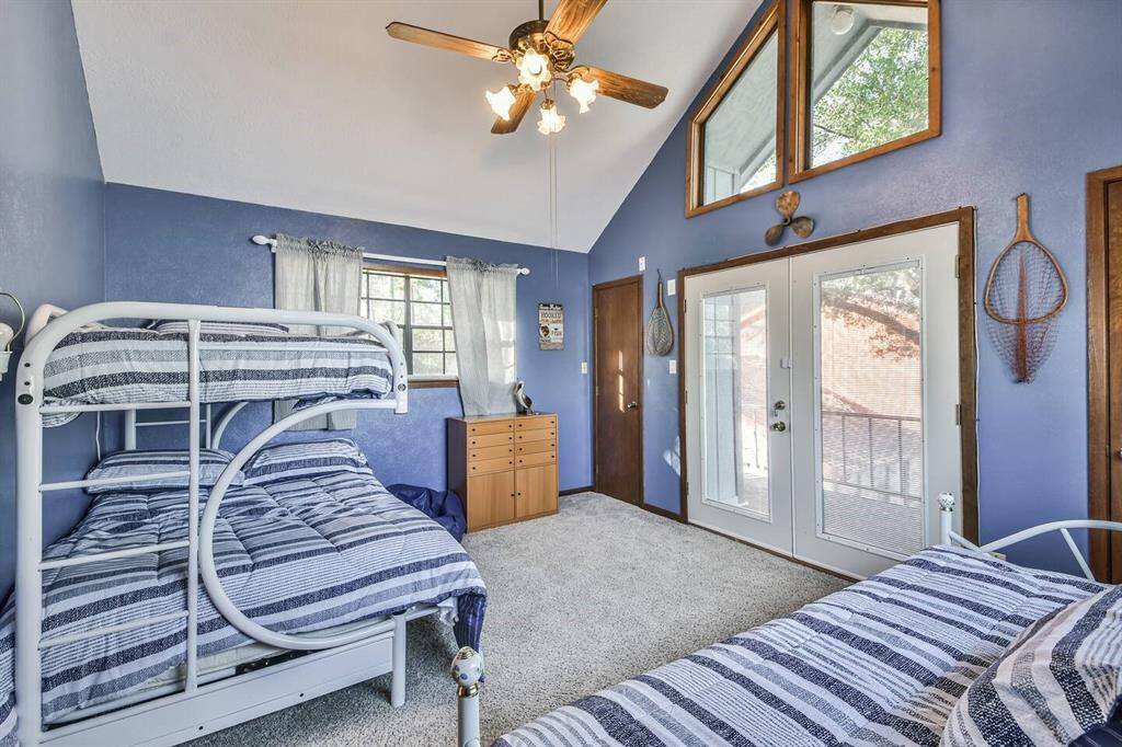 Bedroom with private balcony overlooking lake