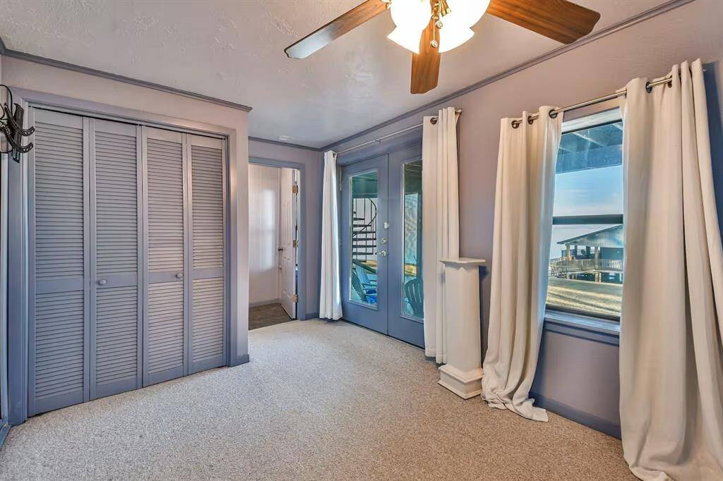level 1 bedroom 2 - walk right out to the covered patio and soak in the views.